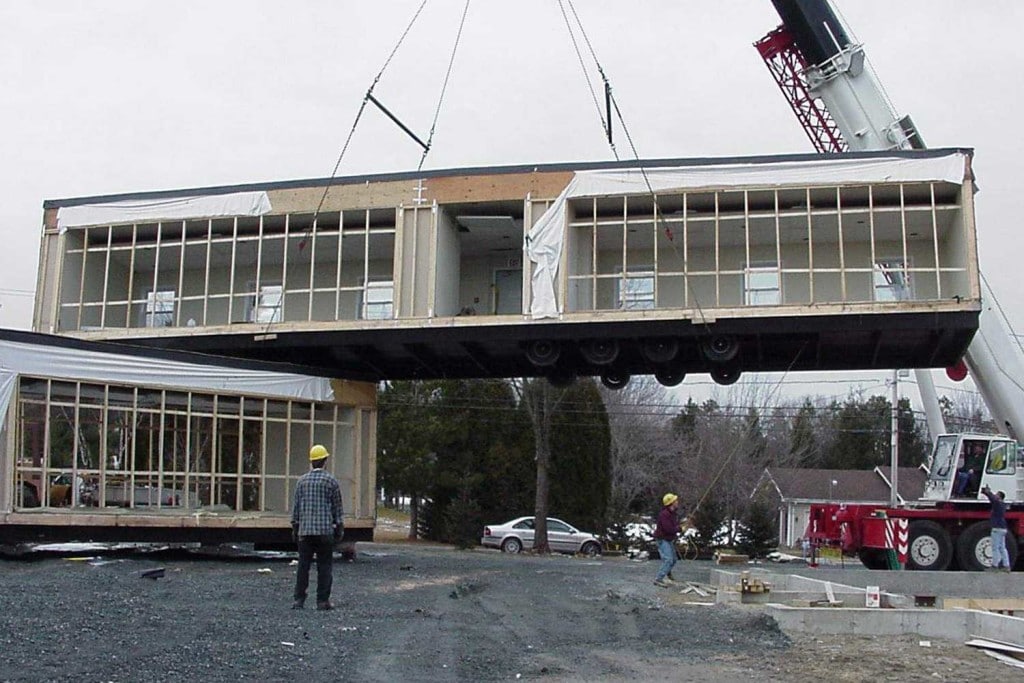 A crane placing modular units in the right spot.