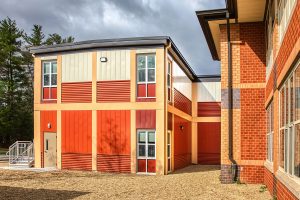 Triumph modular building showcasing vibrant exterior design, exemplifying modern modular construction techniques for both permanent and temporary modular buildings.