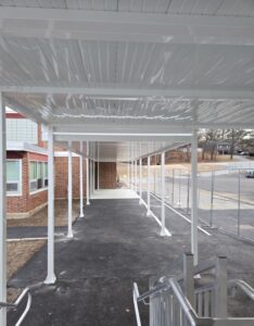 Covered connector and walkway to the existing school building.