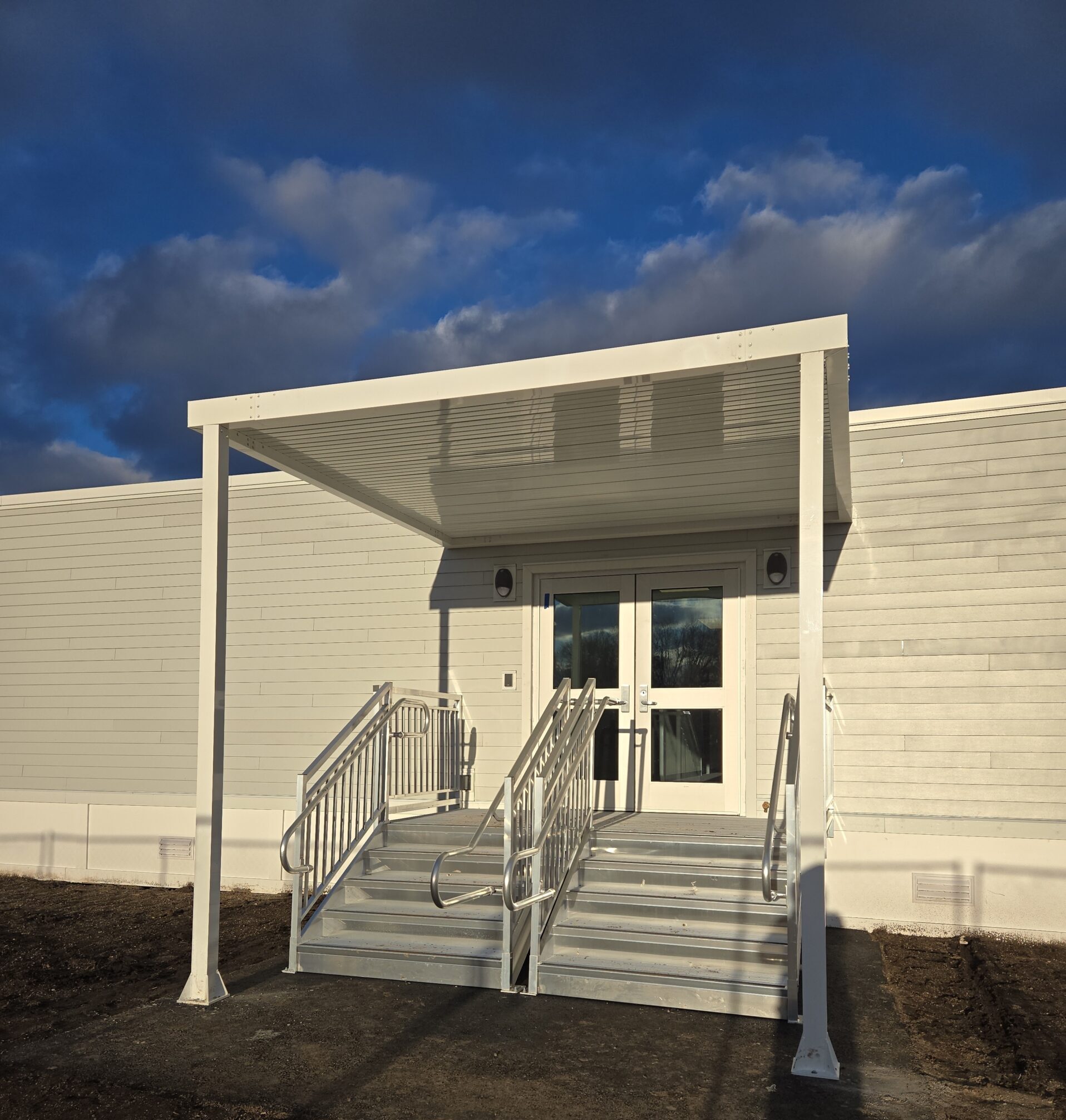 School building exterior entrance with stairs